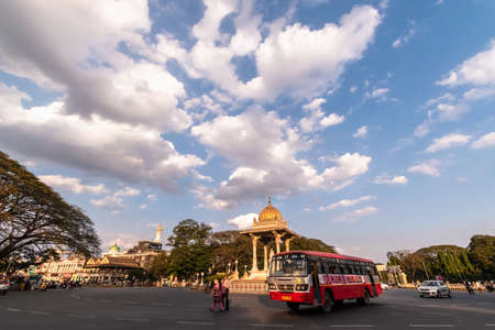 Mysuru, Karnataka, India - January 2019: Big blue skies above traffic running around the Chamaraja Circle in the city of Mysore.のeditorial素材
