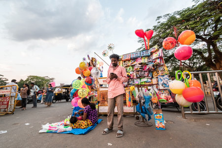 Mysuru, Karnataka, India - January 2019: A street vendor selling colorful balloons and toys at a tourist site in the city of Mysore.のeditorial素材
