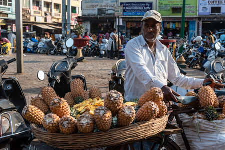 Mysuru, Karnataka, India - January 2019: A street vendor selling fresh jackfruit at his fruit stall...