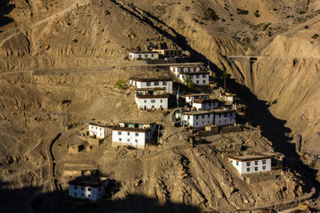 The Himalayan village of Dhankar with houses spread on a steep dry mountain slope in the Spiti...