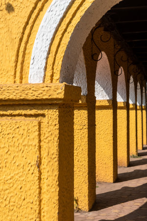 Detail of yellow arches of an old Portuguese era building in Fontainhas in the city of Panjim in Goa.の写真素材