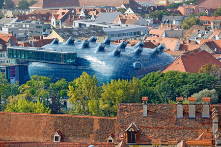 City overview from the hill Schlossberg with the Art Museum Kunsthaus (called also as Friendly Alien) in the middle. Graz, Austria.のeditorial素材