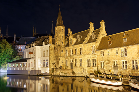 Night view from the promenade Rozenhoedkaai along the canal in the center of medieval city Bruges, Belgium.のeditorial素材