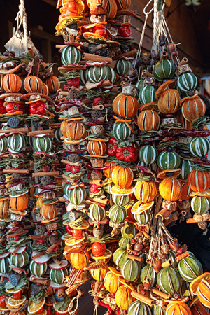 Traditional Christmas decoration made of dry vegetables and fruits at the Christmas market. Vienna, Austria, Europe.の写真素材