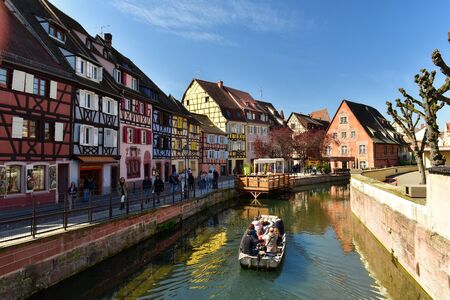 COLMAR, FRANCE - APRIL 18, 2019. Quay view of the Little Venise. Typical half-timbered houses in the background. Town of Colmar, Haut-Rhin, Alsace, France.のeditorial素材