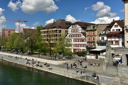 BASEL, SWITZERLAND - APRIL 17, 2019. Embankment of the Rhine river in the historic center of Basel....