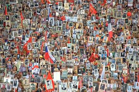 MOSCOW / RUSSIA - MAY 9, 2016. The action `Immortal regiment` during the Victory parade on May 9, 2016: people holding portraits of the fallen soldiers.のeditorial素材