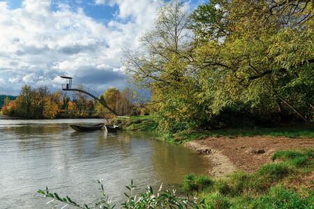 City park on the banks of Aare river in the autumn. Town of Brugg, Swiss canton of Aargau, Switzerland, Europe.の写真素材