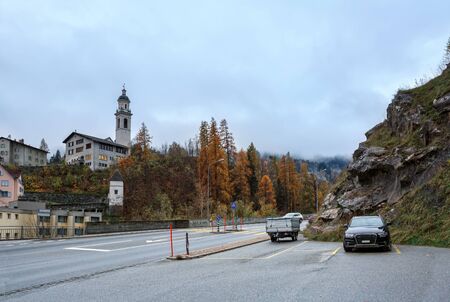 View of the municipality of Albula-Alvra in the fall. Tiefencastel church on a hill. Nature Park Ela, Albula Region, canton of Graubuenden, Switzerland.のeditorial素材