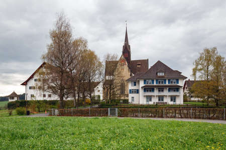 KAPPEL AM ALBIS, SWITZERLAND - APRIL 17, 2018. Ancient monastery Kloster Kappel on a cloudy spring day. Municipality Kappel am Albis, Affoltern district, canton of Zuerich in Switzerland.のeditorial素材