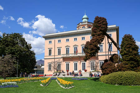 LUGANO, SWITZERLAND - APRIL 17, 2018. Villa Ciani of 19th century in the Park Ciani at the lake...