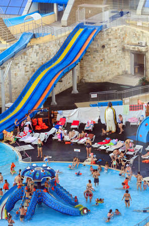 KAZAN, RUSSIA - AUGUST 06, 2020. Outdoor swimming pool with water slide in the Riviera entertainment complex. Aerial view of the water park. City of Kazan, Republic of Tatarstan, Russia.のeditorial素材