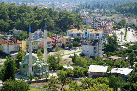 KEMER, TURKEY - AUGUST 21, 2014. Aerial view of the Aslanbucak neighborhood with Karakoyunlu Hasan Ece mosque. Olympos Beydaglari National Park. Town of Kemer, Antalya province, Turkey.のeditorial素材