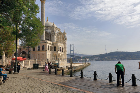 ISTANBUL, TURKEY - OCTOBER 06, 2020. Ortakoy mosque situated at the waterside of the pier. View of the Bosphorus Strait. Besiktas district, city of Istanbul, Turkey.のeditorial素材