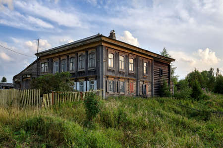 Village street in summer. Old carved wooden house. Ancient village of Visim, Sverdlovsk region, Urals, Russia.の写真素材