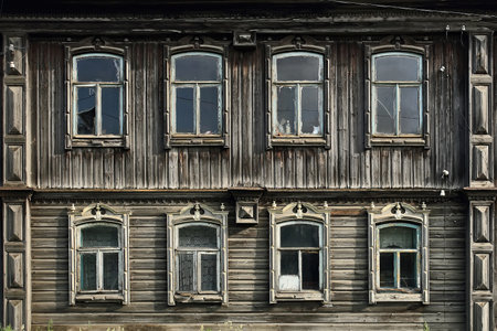 Old russian traditional wooden house with the carved windows. Rundown house. Village of Visim, Sverdlovsk oblast, region of Ural, Russia.の素材 [FY310166098102]