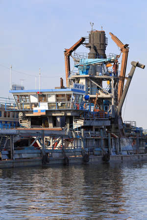 KAZAN, RUSSIA - AUGUST 7, 2021. Floating plant on the Volga river: Dredger ship used for mining sand and gravel and ship with accommodation for workers. Republic of Tatarstan, Russia.のeditorial素材