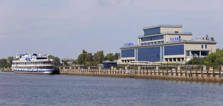 KAZAN, RUSSIA - AUGUST 7, 2021. Main passenger terminal in the river port of Kazan on the Volga river. Passenger cruise ship moored in front of terminal. City of Kazan, Republic of Tatarstan, Russia.のeditorial素材