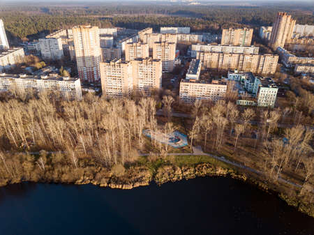 Aerial view of the residential neighborhood and public park on the banks of Pekhorka river on a sunny autumn day. City of Balashikha, Moscow oblast, Russia.の写真素材