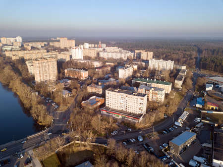 BALASHIKHA, RUSSIA - NOVEMBER 1, 2021. Aerial view of city, river and forest on a sunny autumn day. City of Balashikha, Moscow region, Russia.のeditorial素材