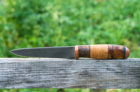 hunting knife on the old board