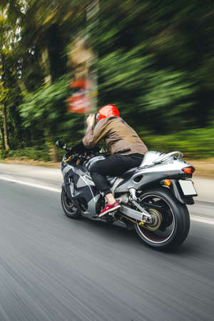 High speed motorcycle biking on the roadの写真素材