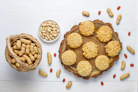Homemade crunchy cookies with peanuts on white wooden background,top viewの写真素材