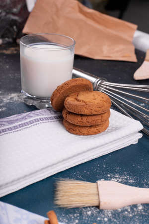 Cup of tea with cinnamon biscuits on tableの写真素材