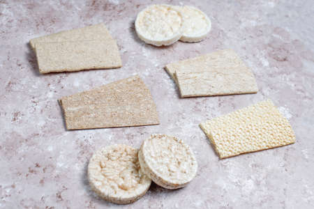 Different types of crispbread.Healthy food concept.White brown background.Top viewの写真素材