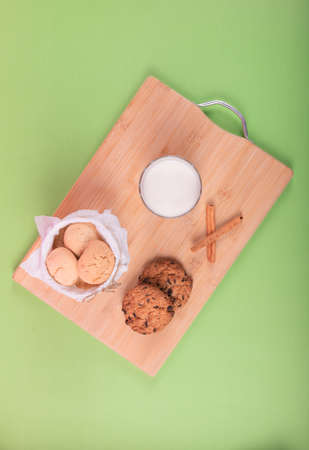 Cup of milk with cinnamon biscuitsの写真素材