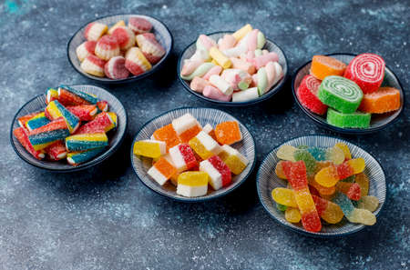Colorful candies, jelly and marmalade on dark grey background,top viewの写真素材