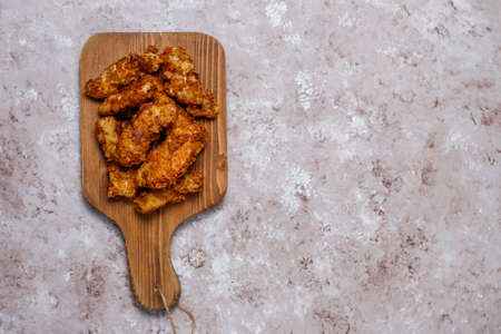 Chicken strips with ketchup and mayonnaise. top view on brown light background.の写真素材