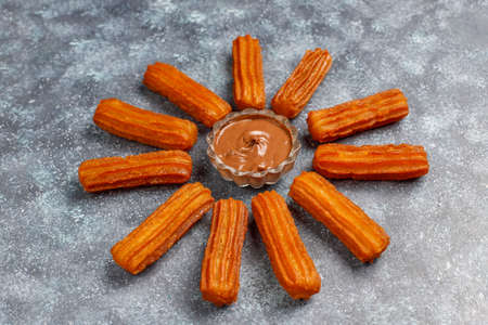 Traditional Mexican dessert churros with chocolate,top viewの写真素材