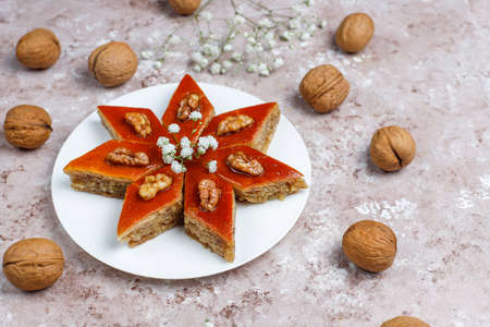 Azerbaijan national pastry pakhlava on white plate on light background ,top view,spring new year celebration Novruz holiday.の写真素材