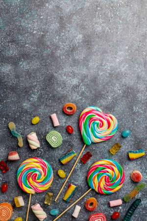 Colorful candies, jelly and marmalade on dark grey background,top viewの写真素材