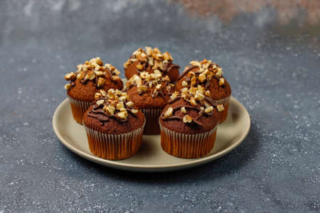 Chocolate-walnut muffins on dark background ,Selective Focus.の写真素材