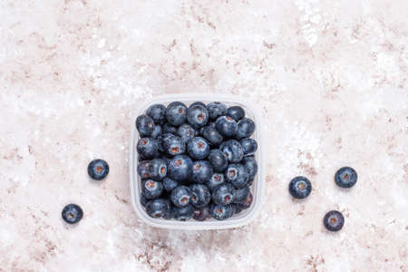 natural blueberries on light brown background,top view,copy spaceの写真素材