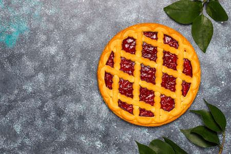 Delicious traditional berry cherry pie Crostata on grey dark backgroundの写真素材