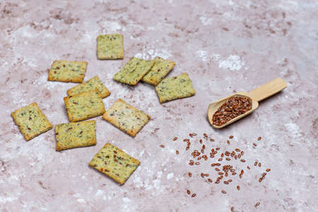 Crackers with olive oil,linen seeds and greens,top viewの写真素材