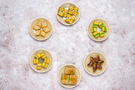 Traditional oriental sweets with different nuts on concrete background, top view, copy spaceの写真素材