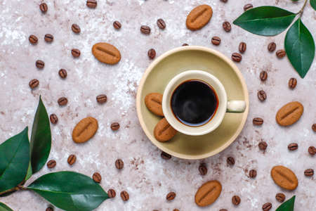 Composition with roasted coffee beans and coffee bean shaped cookiesの写真素材
