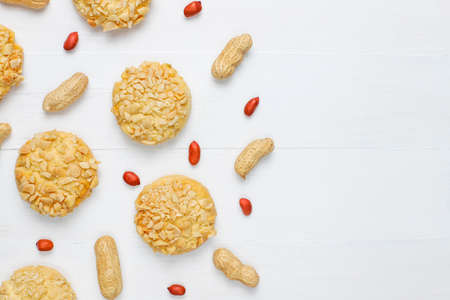 Homemade crunchy cookies with peanuts on white wooden background,top viewの写真素材