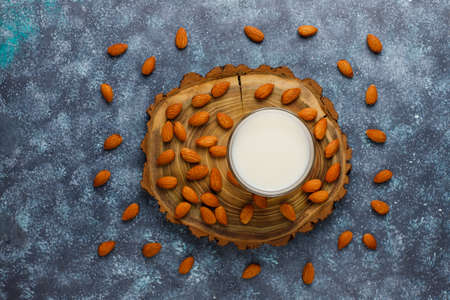 Almond milk with almond on dark grey background,top viewの写真素材