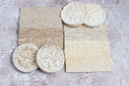 Different types of crispbread.Healthy food concept.White brown background.Top view