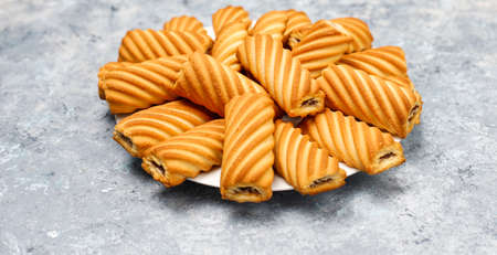 cookies with jam filling on concrete background,top view