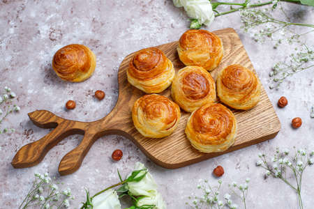 Azerbaijan national pastry qogal on white plate on light background ,top view,spring new year celebration Novruz holiday.の写真素材