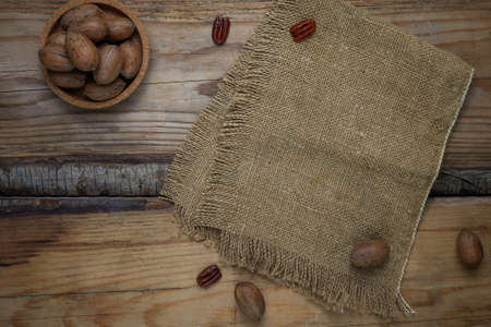 Pecan nuts on rustic background,top viewの写真素材