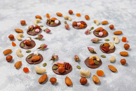 Handmade chocolate mediants, cookies, bites, candies,nuts. Copy space. Top view.
