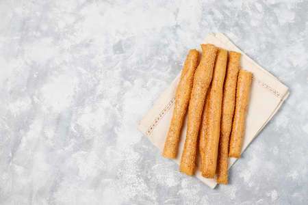 Bread sticks with sesame seeds on grey concrete background,top viewの写真素材