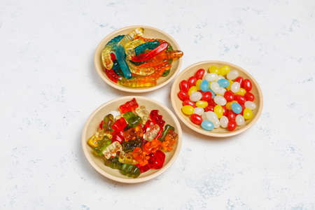 Colorful candies, jelly,marshmallow on light background. Top view with copy spaceの写真素材